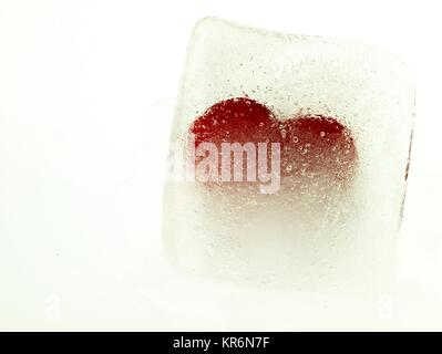 Red heart embedded in ice Stock Photo