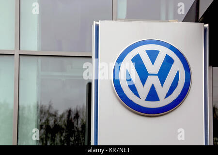 TURKU, FINLAND - FEBRUARY 23, 2014: Sign Volkswagen in front of a building. The proposed sale of Swedish truck giant Scania to Volkswagen is hanging i Stock Photo