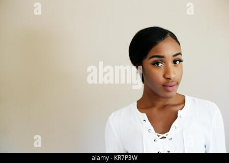 Portrait of serious mixed race woman Stock Photo