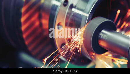 Finishing metal working on high precision grinding machine in workshop Stock Photo
