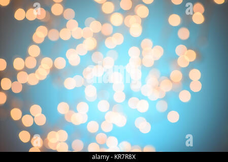 Vintage lights background. Blue golden bokeh texture, blurred. Stock Photo