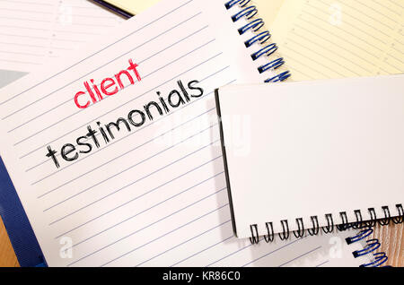 Client testimonials text concept on notebook Stock Photo