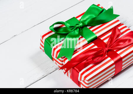 Giftwrapped Christmas Presents on White Wooden Table Stock Photo
