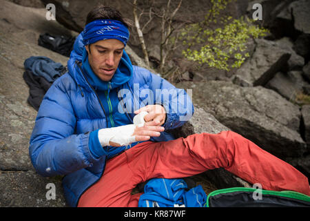 Climbers prepare to rock climb a long crack Stock Photo