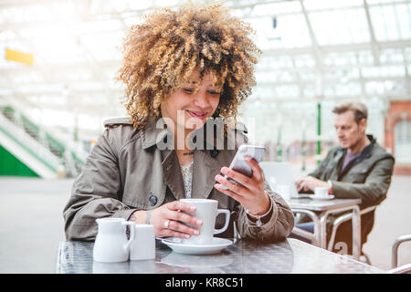 Enjoying a coffee while I wait Stock Photo