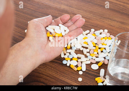Person's Hand With Pills Stock Photo