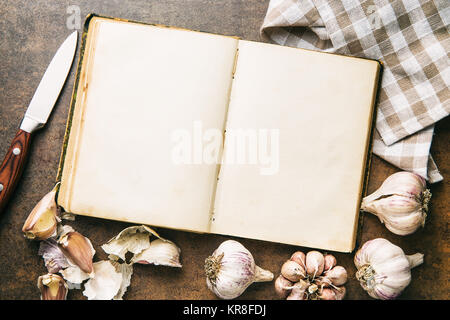 Blank cookbook and garlic. Stock Photo