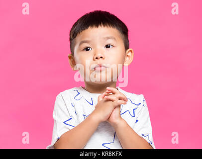 Little boy praying Stock Photo