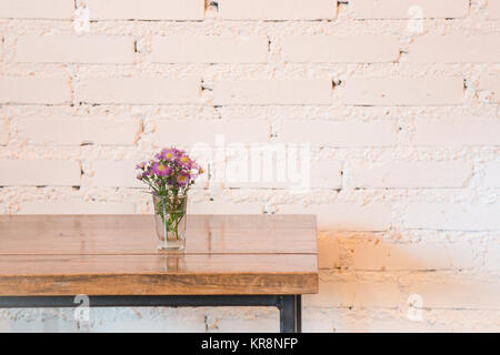 Room interior white brick wall with wooden table Stock Photo