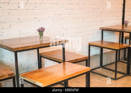 Room interior white brick wall with wooden table Stock Photo