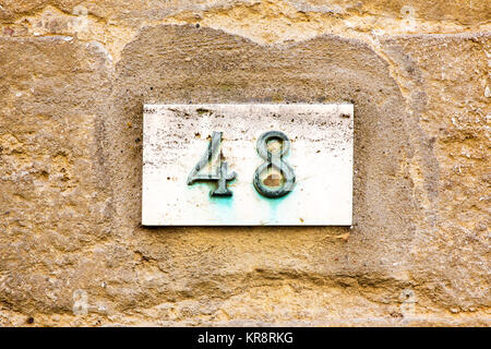 House number 48 on wall Stock Photo