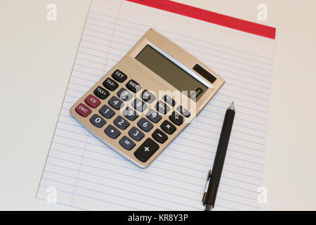 Calculator pad and pencil  on white background Stock Photo