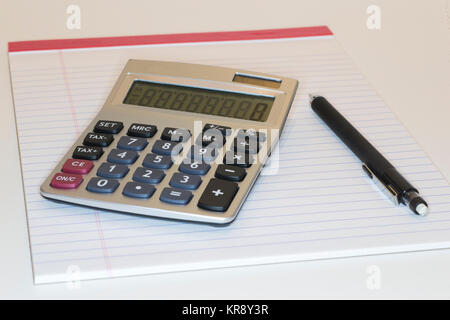 Calculator pad and pencil  on white background Stock Photo