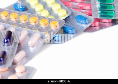 Bunch of pills and capsules in aluminum container Stock Photo