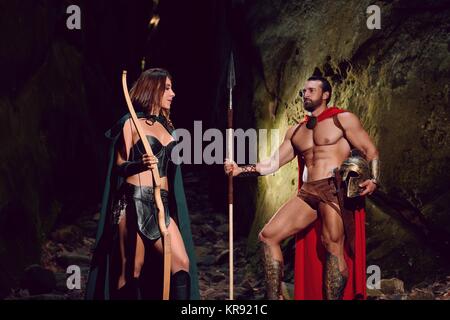 Spartan warrior and his woman in the woods Stock Photo - Alamy