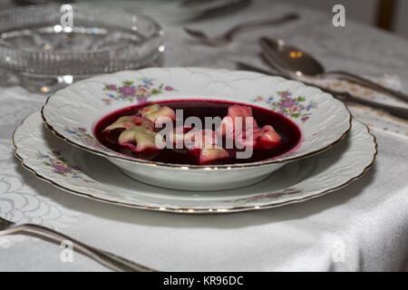 Red borscht with mushroom ravioli Stock Photo