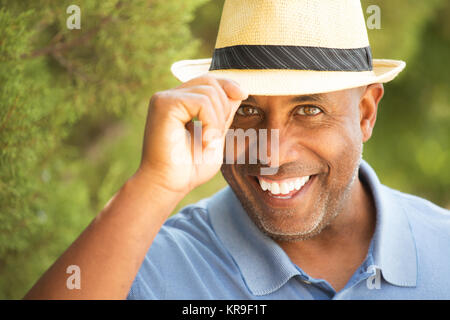 African American man tipping his hat outside. Stock Photo