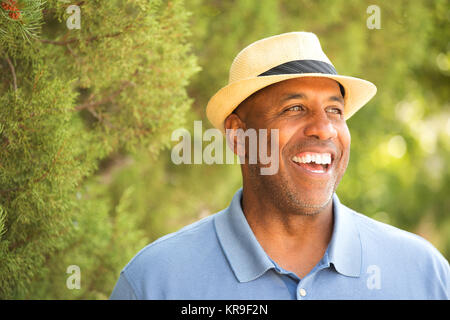 African American man tipping his hat outside. Stock Photo