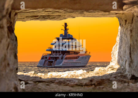 Luxury yacht through stone window view Stock Photo