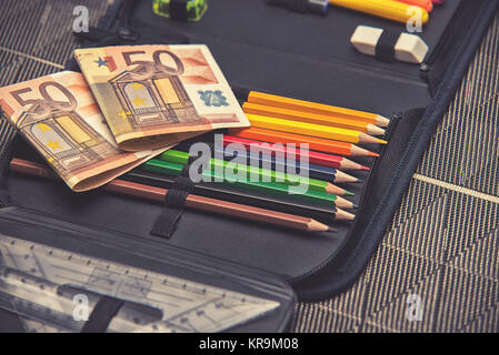 expensive school theme, pencil case with euro money Stock Photo