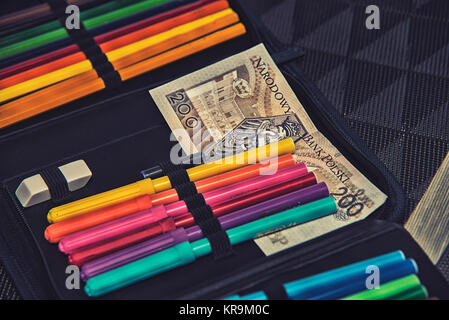 expensive school theme,pencil case with polish money Stock Photo