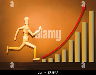 The wooden figure running on stairs of business plan Stock Photo