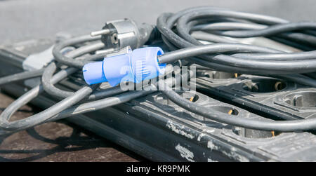 blue electric plug on black cable Stock Photo