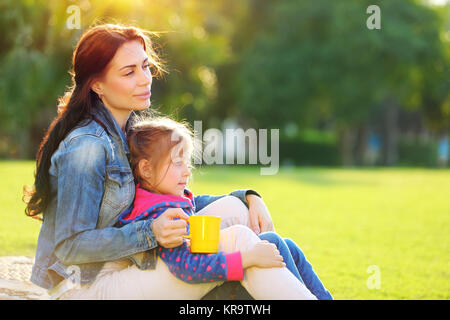 Mother with daughter outdoors Stock Photo