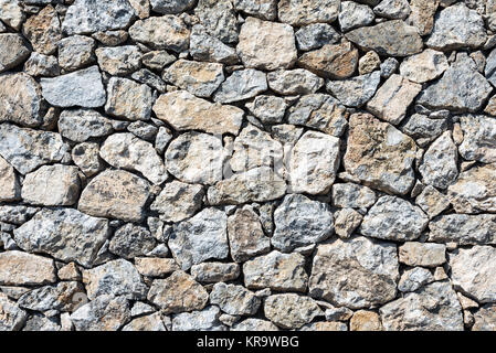 background of a rustic stone wall Stock Photo