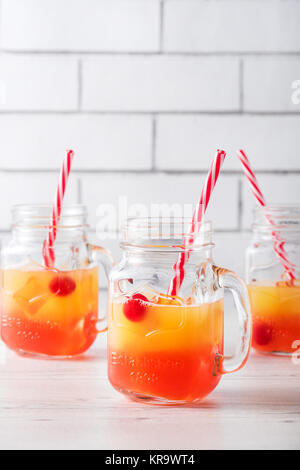 Tequila sunrise cocktails in glass jar Stock Photo