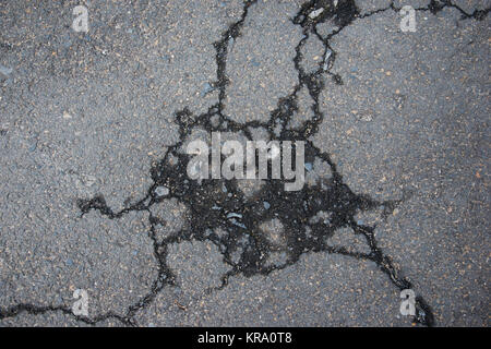 Cracked road alphalt texture, broken ground structure photo Stock Photo