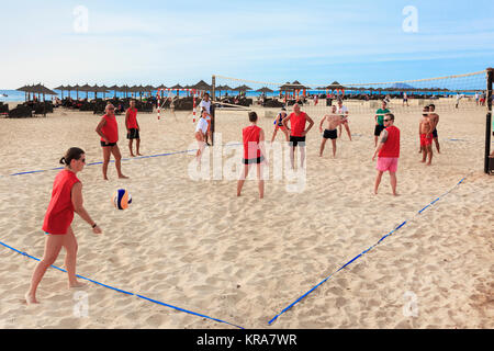 Tourists playing beach volleyball on Bikini Beach, Santa Maria, Sal Island, Salina, Cape Verde, Africa Stock Photo