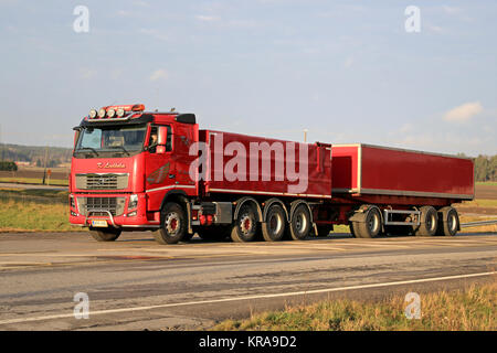 SALO, FINLAND - NOVEMBER 16, 2014: Red Volvo FH16 540 with full trailer on the road. The Volvo FH16 is the world's most powerful series-produced truck Stock Photo