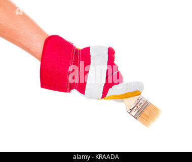 gloved hand with brush Stock Photo