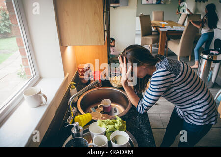 Stressed mother of three Stock Photo