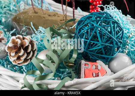 Christmas toys in a wicker basket Stock Photo