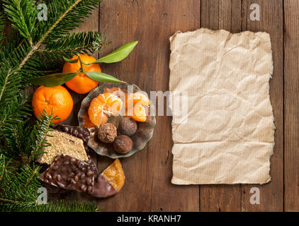 Chocolate, truffles and tangerins Stock Photo