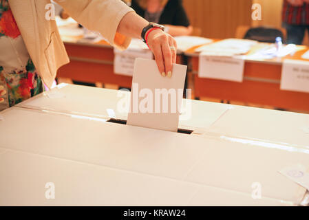 A voter casts her ballot for a presidential election in Sofia, Bulgaria ...