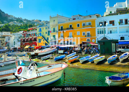 Boats, buildings and hills on the coast of Capri Stock Photo