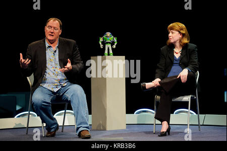 John Lasseter, Director of the film 'Toy Story', left, and Margaret Weitekamp, a curator at the Smithsonian National Air and Space Museum, conduct a discussion at the museum's Moving Beyond Earth Gallery, Thursday, March 29, 2012, in Washington. Action figure Buzz Lightyear, standing center, launched May 31, 2008 aboard the space shuttle Discovery (STS-124) and returned on Discovery 15 months later with STS-128, is the longest serving toy in space and became part of the museum's popular culture collection. Photo Credit: (NASA/Paul E. Alers) John Lasseter, Margaret Weitekamp, 2012 Stock Photo