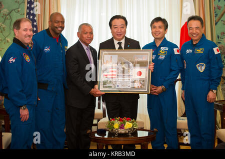 Japanese Prime Minister Yoshihiko Noda, fourth from left, accepts a montage from NASA Administrator Charles Bolden, third from left, during a meeting at the Blair House as Associate Administrator for Science and former Astronaut John Grunsfled, left, Associate Administrator for Education and former Astronaut Leland Melvin,  second from left, JAXA (Japan Aerospace Exploration Agency) Astronaut Koichi Wakata, and JAXA (Japan Aerospace Exploration Agency) Astronaut Satoshi Furukawa, right, look on, Monday, April 30, 2012, in Washington. Photo Credit: (NASA/Bill Ingalls) NASA Administrator meets J Stock Photo
