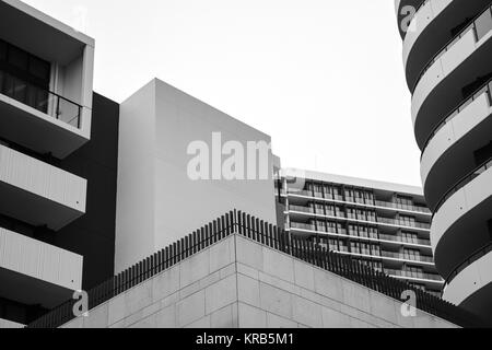 Modern apartment buildings at Rhodes in Sydney, Australia. Apartment blocks in the modern suburb of Rhodes in Sydney, Australia. Black and white photo Stock Photo