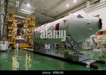 In the Integration Facility at the Baikonur Cosmodrome in Kazakhstan, the Soyuz TMA-07M spacecraft is seen in the background against the Soyuz booster rocket upper stage (in the foreground) as technicians worked to encapsulate the vehicle in the upper stage Dec. 12, 2012 for the launch of the Expedition 34/35 crew. The vehicle will be rolled to the launch pad at Baikonur Dec. 17 in advance of the Dec. 19 launch of NASA Flight Engineer Tom Marshburn, Soyuz Commander Roman Romanenko and Flight Engineer Chris Hadfield of the Canadian Space Agency for a five-month mission on the International Spac Stock Photo