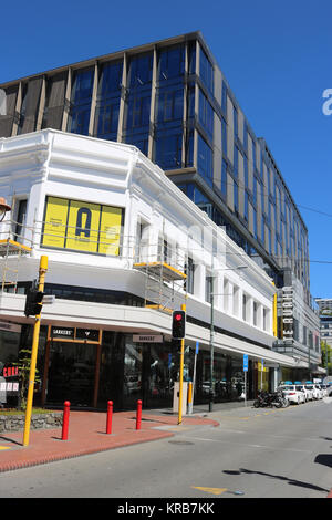 View along a city center street in Wellington, New Zealand from Cuba Street with a line of taxis at the roadside outside shops. Stock Photo