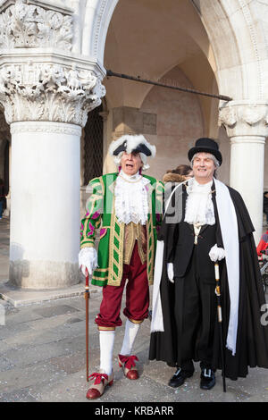 Venice Carnival 2017, Veneto, Italy. The mayor of Venice , Luigi Brugnaro, enjoying himself  in Piazza San Marco with an unknown man in historic costu Stock Photo