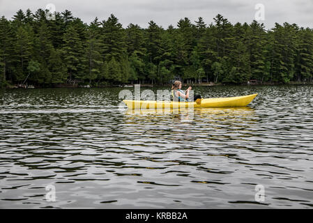 family kayaking on Flying Pond, Mount Vernon, Maine Stock Photo