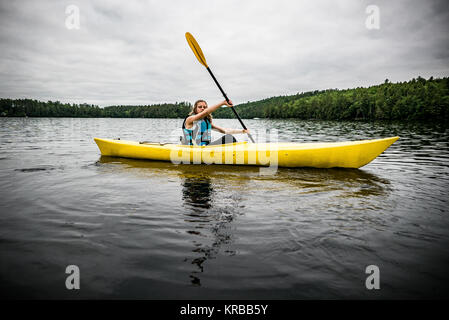 family kayaking on Flying Pond, Mount Vernon, Maine Stock Photo