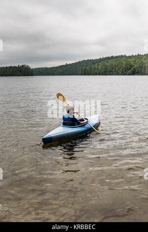 family kayaking on Flying Pond, Mount Vernon, Maine Stock Photo