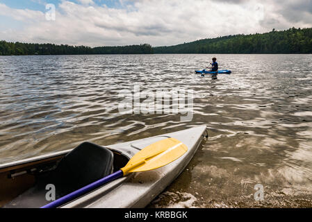 family kayaking on Flying Pond, Mount Vernon, Maine Stock Photo