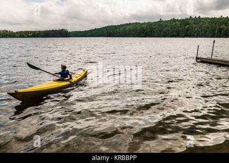 family kayaking on Flying Pond, Mount Vernon, Maine Stock Photo